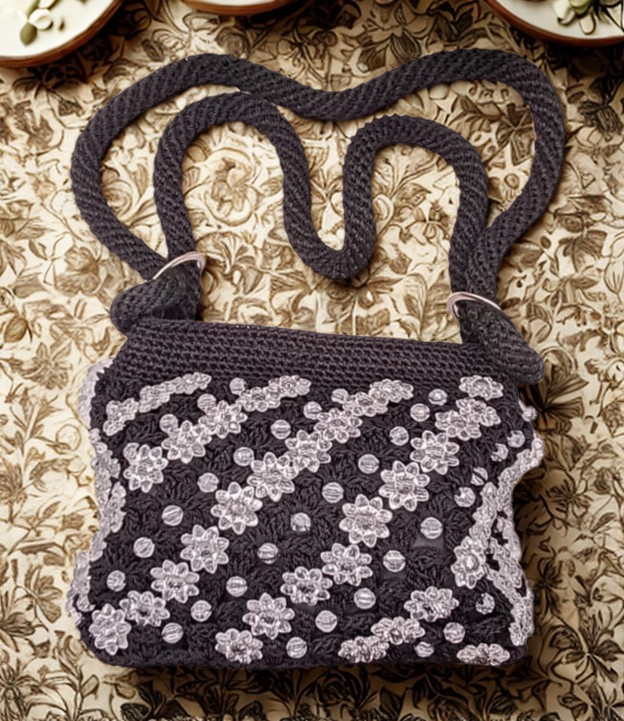 Bolsa Hilo Omega, flores transparentes, negra, tejido premium.